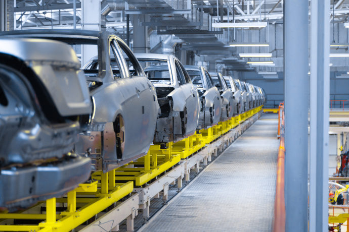 automobile production line, automated production equipment. Shop for the Assembly of new modern cars. The way of Assembly of the car on the Assembly line of car frames inside a plant